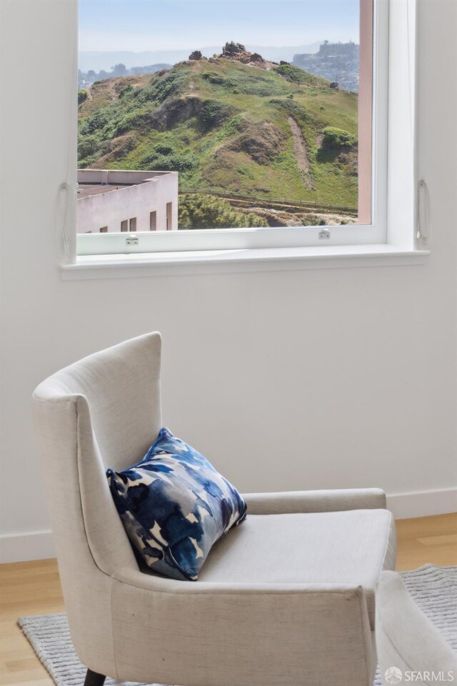 355 Buena Vista E Avenue 605W, San Francisco, CA 94117 - sitting room featuring baseboards, a mountain view, and wood finished floors