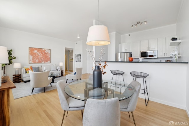 355 Buena Vista E Avenue 605W, San Francisco, CA 94117 - dining area with baseboards and light wood finished floors