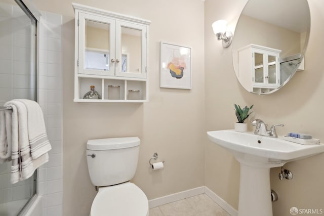 355 Buena Vista E Avenue 605W, San Francisco, CA 94117 - bathroom featuring baseboards, a sink, tile patterned flooring, and toilet