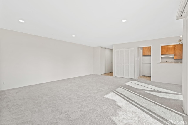 816 N Delaware St Unit 409, San Mateo, CA 94401 - unfurnished living room featuring light carpet and recessed lighting