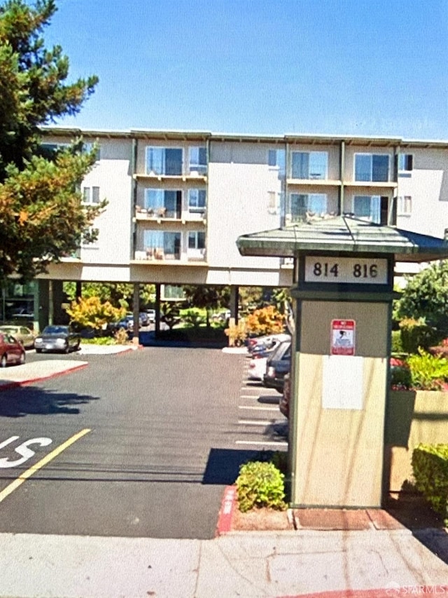 816 N Delaware St Unit 409, San Mateo, CA 94401 - view of apartment building / complex with a parking lot