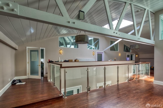 bar featuring hardwood / wood-style floors, beamed ceiling, and high vaulted ceiling