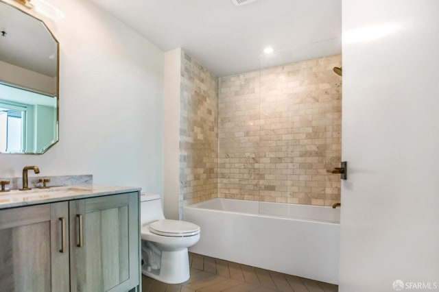 bathroom featuring toilet, bathing tub / shower combination, visible vents, and vanity