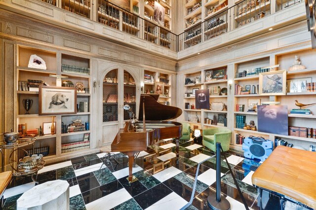 sitting room with a high ceiling