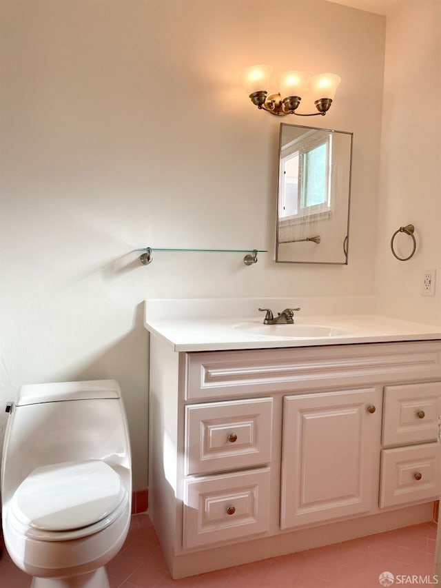 bathroom featuring toilet, tile patterned floors, and vanity