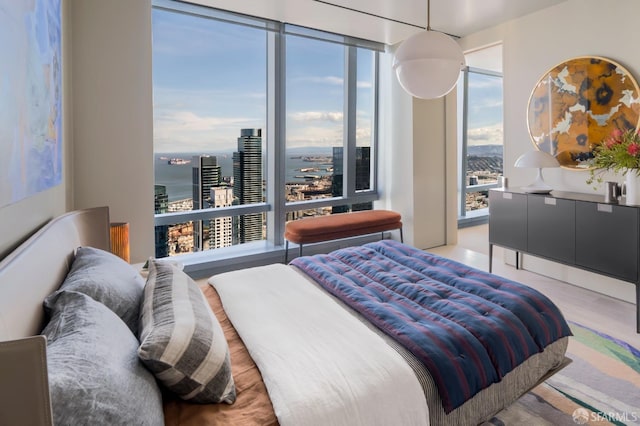 181 Fremont St Unit 62B, San Francisco, CA 94105 - bedroom featuring light wood-type flooring and a city view