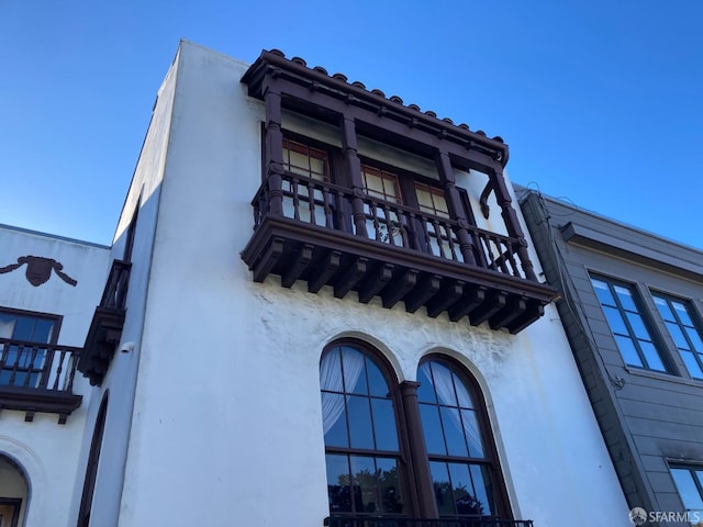 view of property exterior featuring a balcony