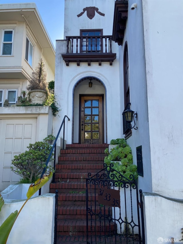 entrance to property with a balcony