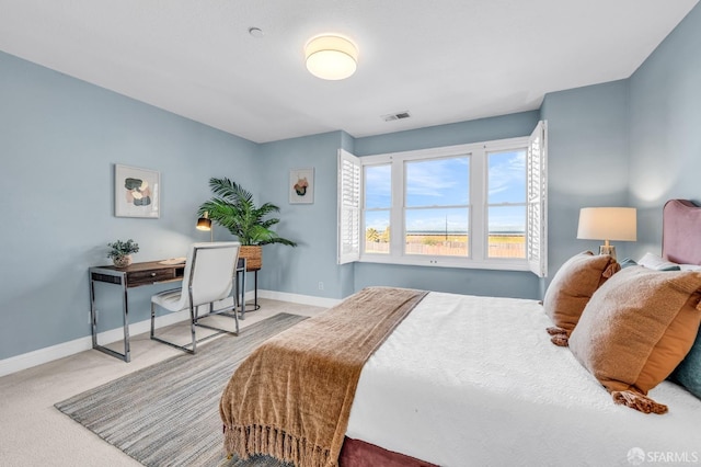 bedroom featuring baseboards, visible vents, and carpet floors