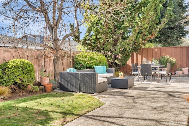 view of patio with an outdoor living space and a fenced backyard