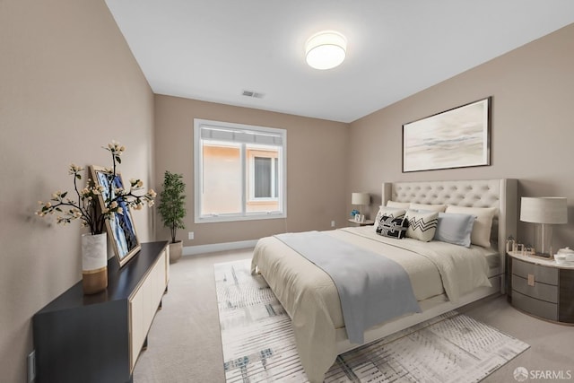 bedroom featuring light carpet, visible vents, and baseboards