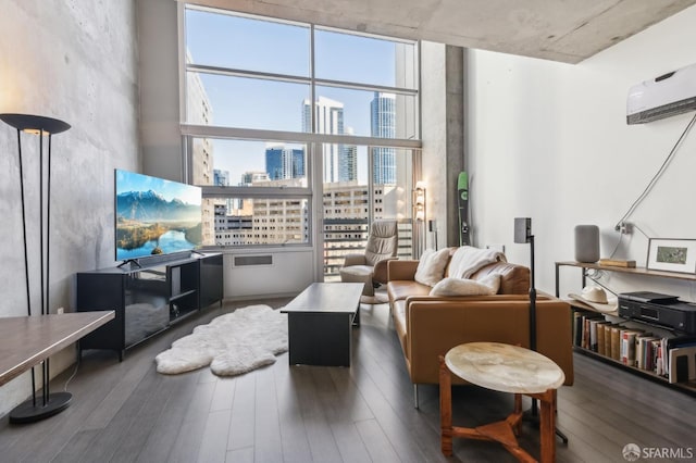 living room with wood-type flooring and floor to ceiling windows