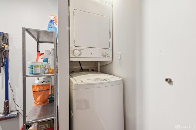 clothes washing area with stacked washer / drying machine