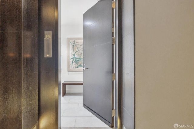 hallway with light tile patterned floors