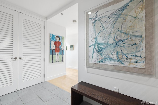 hallway with light tile patterned floors