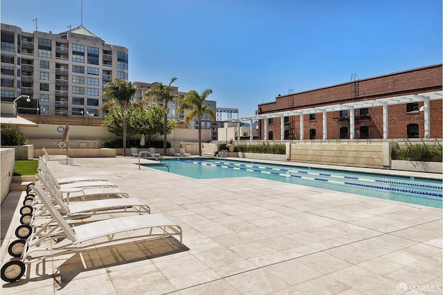 view of swimming pool with a patio area