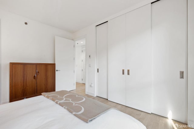 bedroom with light wood-type flooring