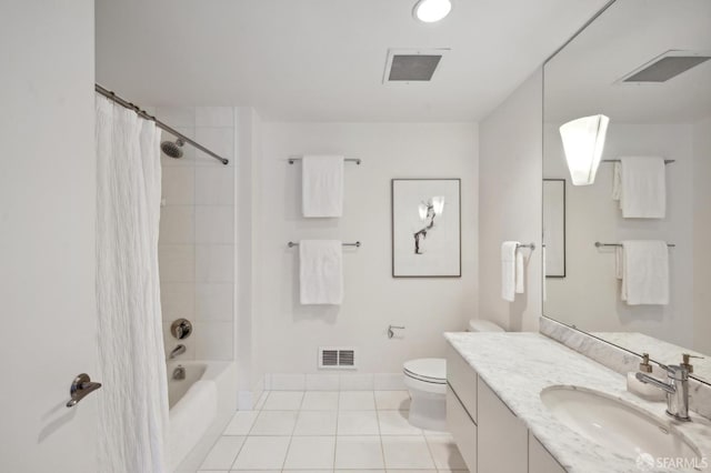 full bathroom with tile patterned flooring, shower / bath combo with shower curtain, vanity, and toilet