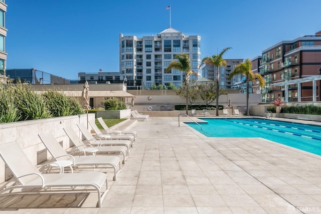 view of swimming pool featuring a patio area