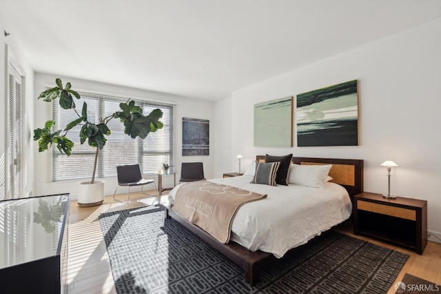 bedroom with hardwood / wood-style floors