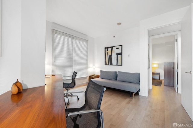 office space with light wood-type flooring