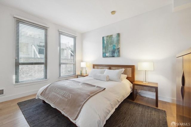 bedroom with light wood-type flooring