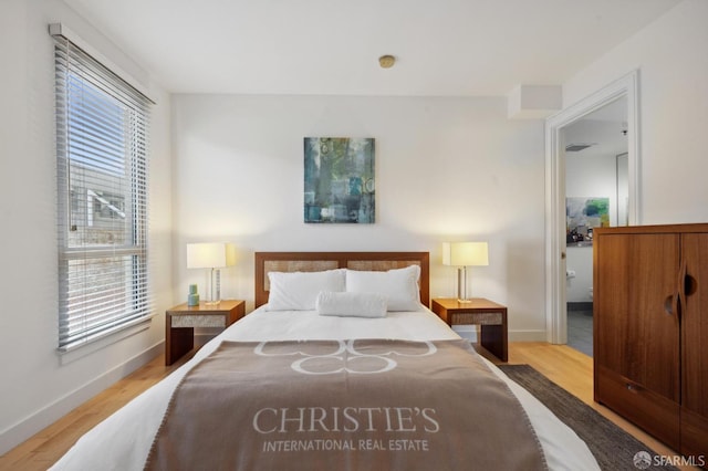 bedroom with light hardwood / wood-style flooring