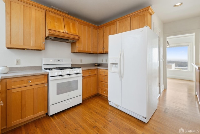 kitchen featuring recessed lighting, white appliances, light countertops, light wood-type flooring, and custom range hood