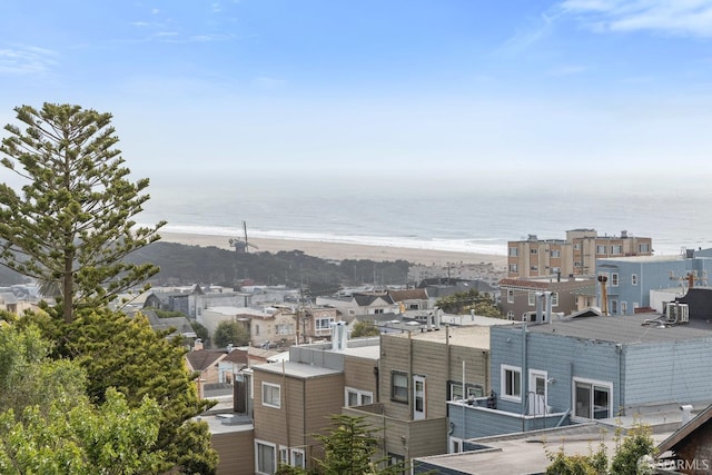 view of city featuring a water view and a beach view