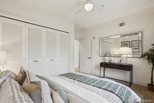 carpeted bedroom featuring a closet, a ceiling fan, baseboards, and visible vents