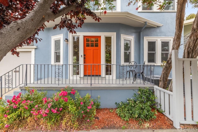 4145 Emerald St, Oakland, CA 94609 - doorway to property featuring stucco siding and a porch