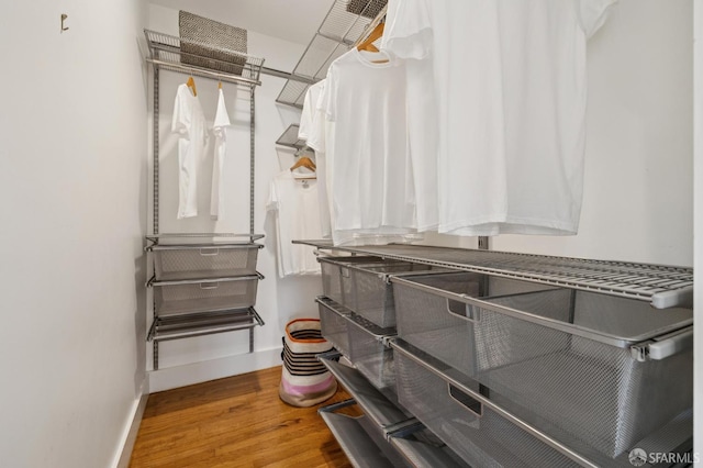 4145 Emerald St, Oakland, CA 94609 - walk in closet featuring wood finished floors