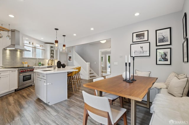 4145 Emerald St, Oakland, CA 94609 - dining room with stairway, light wood-type flooring, and recessed lighting