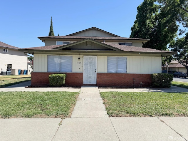 1200 Lemontree Way Unit 1, Antioch, CA 94509 - view of front of home featuring brick siding, a front lawn, and a shingled roof