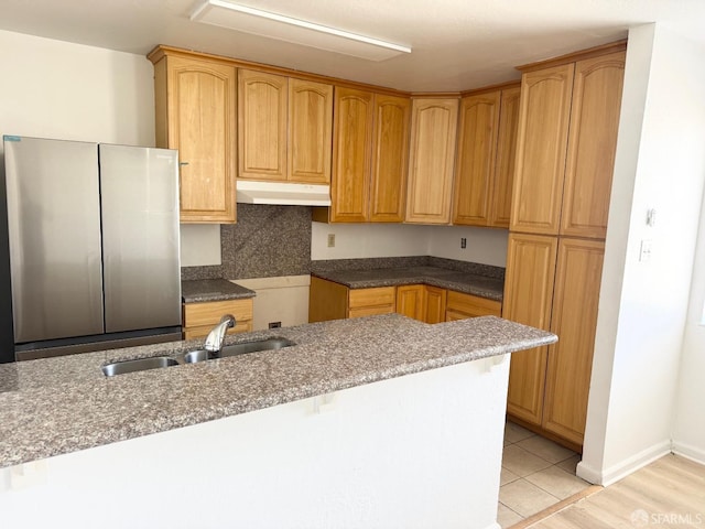 1200 Lemontree Way Unit 1, Antioch, CA 94509 - kitchen featuring under cabinet range hood, freestanding refrigerator, and a breakfast bar area