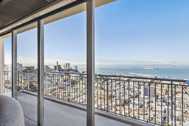 balcony featuring a water view