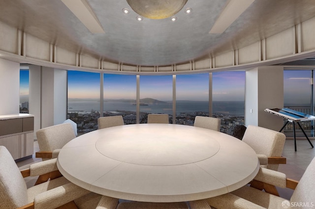 dining area featuring floor to ceiling windows