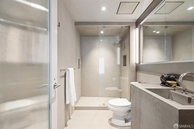 bathroom with tile patterned flooring, toilet, a shower with door, and sink