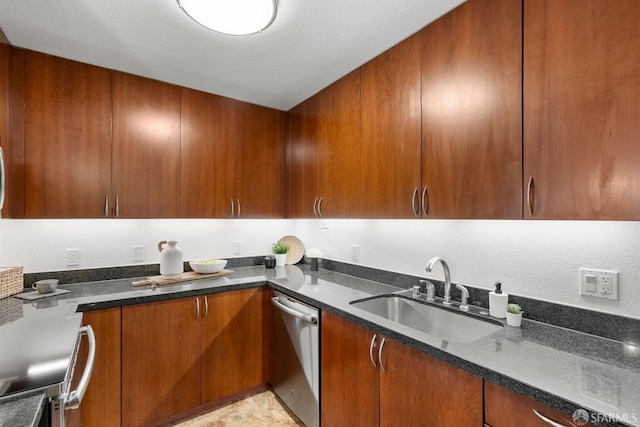 kitchen with sink, dishwasher, a textured ceiling, and dark stone countertops