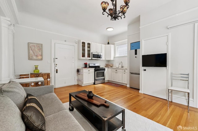1932 Fell St Unit 1, San Francisco, CA 94117 - living room with light wood-style flooring and a chandelier