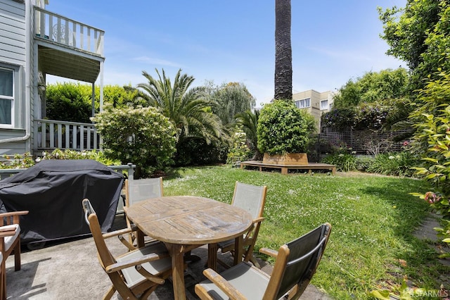 1932 Fell St Unit 1, San Francisco, CA 94117 - view of green lawn with outdoor dining space, a balcony, and a patio area