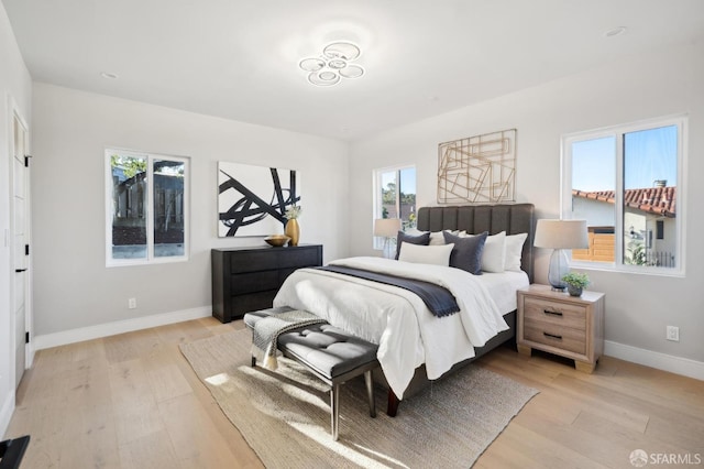 bedroom with light hardwood / wood-style flooring