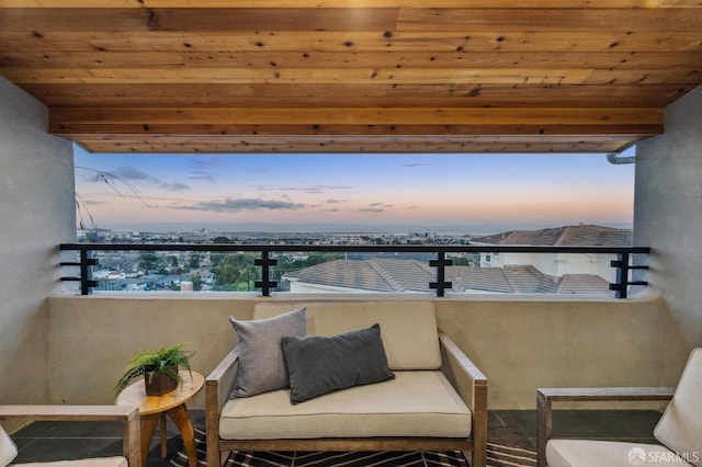 view of balcony at dusk