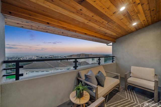 view of balcony at dusk