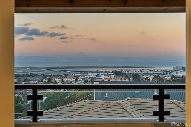 balcony at dusk with a water view