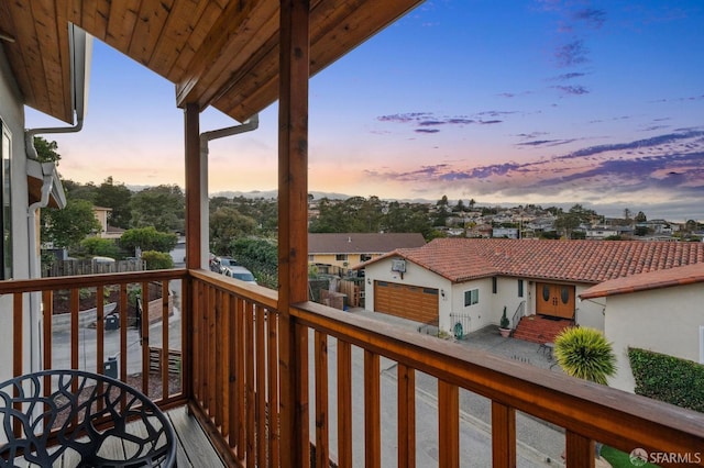 view of balcony at dusk