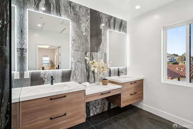 bathroom featuring tile patterned flooring, vanity, tile walls, and backsplash