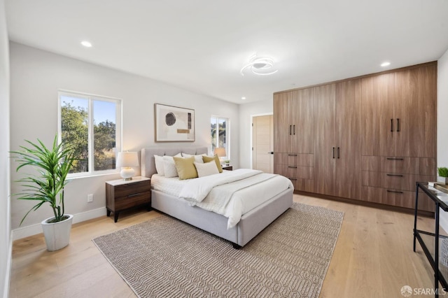 bedroom with light wood-type flooring