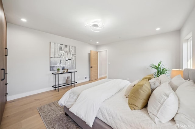 bedroom with light hardwood / wood-style floors