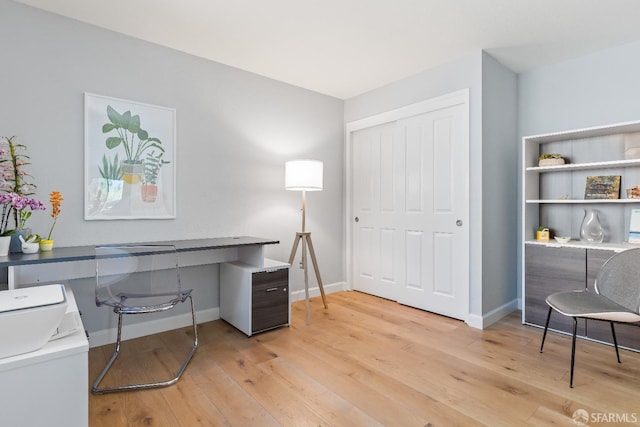 1541 Moraga Way, Moraga, CA 94556 - office area featuring washer / clothes dryer, light wood finished floors, and baseboards